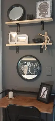 a room with a table with a mirror and shelves at V's Condo in Gordonʼs Bay