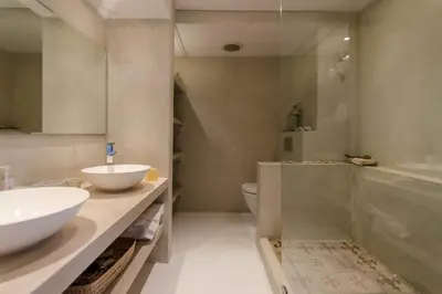 a bathroom with a sink and a toilet and a tub at Dolphin Hill Apartment, Cape Town, Dolphin Beach in Cape Town