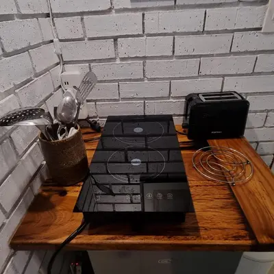 a laptop computer sitting on top of a wooden table at The Sculpture Yard in Gordonʼs Bay