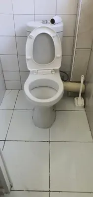 a bathroom with a white toilet in a stall at Skyway Sleep and go in Cape Town