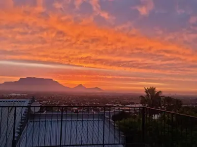 a view of the sunset from the top of a building at Grace Space in Plattekloof in Cape Town