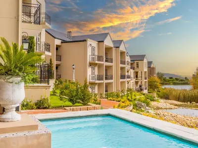 an image of an apartment complex with a swimming pool at W-Collection Franschhoek L'Ermitage Villas in Franschhoek