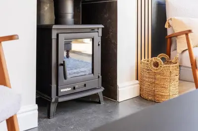 a fireplace with a television in a living room at 2D on Nansen in Cape Town