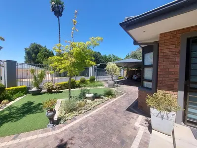 a house with a courtyard with a garden at 7Pillars Shiraz in Durbanville