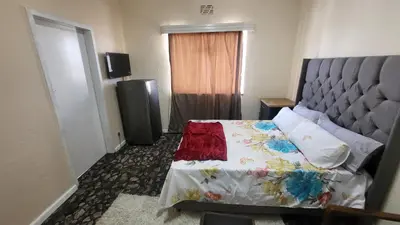 a hotel room with a bed and a television at The Vasco in Cape Town