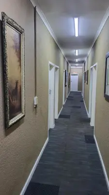 a hallway with a painting of a horse on the wall at The Vasco in Cape Town