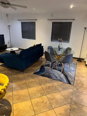 a living room with a couch and a table at Shalom in Cape Town