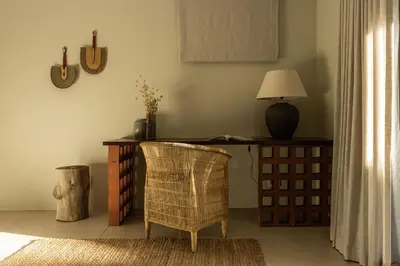 a desk in a room with a chair and a lamp at Spioenkop Wines Farm House in Elgin
