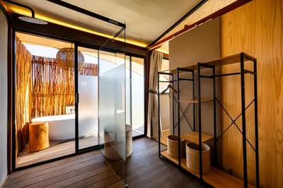 a room with glass doors and a room with wood floors at Amperbo Glamping in Cape Town