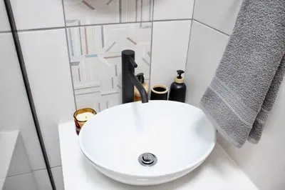 a bathroom with a white sink in a bathroom at Yellow Couch Studio Apartment 1 KingBed in Cape Town