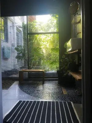 a room with a large window with a fish tank at The Secret Room in Somerset West