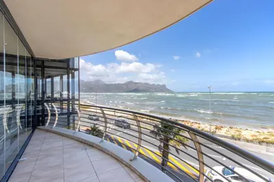 a view of the ocean from the balcony of a building at Atlantica202 in Strand