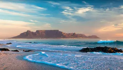 a view of a beach with a mountain in the background at 151 Gie Road in Cape Town