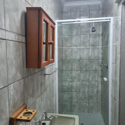 a bathroom with a sink and a shower at Acanthus Circle in Cape Town