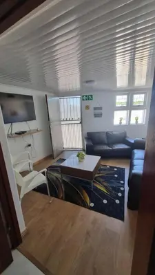 a living room with a couch and a table at Acanthus Circle in Cape Town