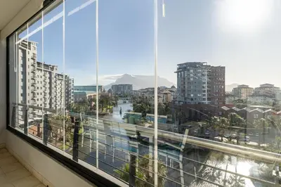 a view of a city from a large window at Skyline Serenity - Knightsbridge in Cape Town