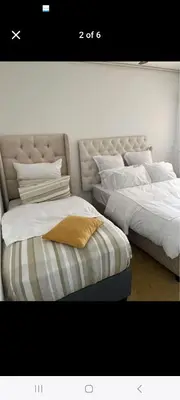 two beds sitting next to each other in a room at 27 on Milton in Cape Town