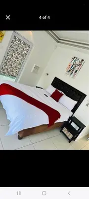 a bedroom with a large bed in a room at 27 on Milton in Cape Town