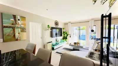 a dining room with a table and chairs at Luxury 2bedrooms house in Cape Town