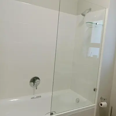 a shower with a glass door in a bathroom at The Cozy Nest in Cape Town