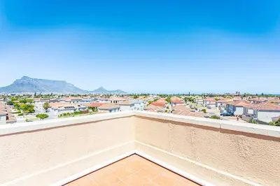 a balcony with a view of a city at Villa Italia 933 by CTHA in Cape Town