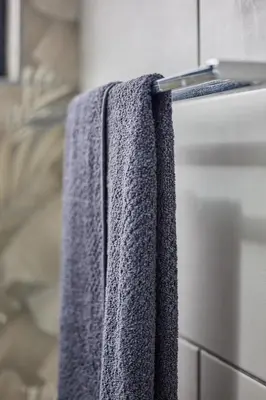 a towel hanging on a towel rack in a bathroom at Peppertree Place in Cape Town