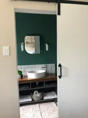 a bathroom with a sink and a mirror at Bettys Bay Breakaway in Bettyʼs Bay