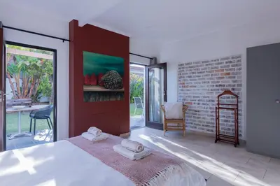 a bedroom with a bed with two towels on it at 2stay Apartment Protea - Cape Town Bloubergstrand in Cape Town