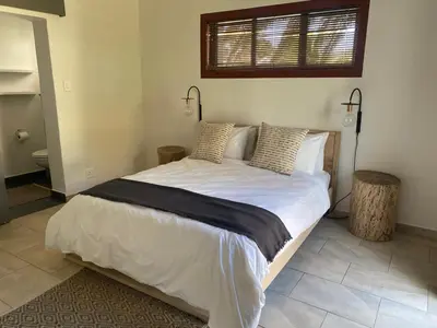 a bedroom with a large white bed with two pillows at 2stay Apartment Protea - Cape Town Bloubergstrand in Cape Town