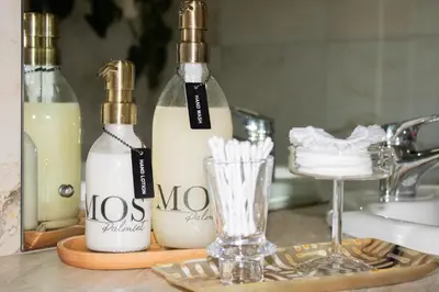 a counter with two bottles of milk and a glass at MOS- Palmiet in Kleinmond