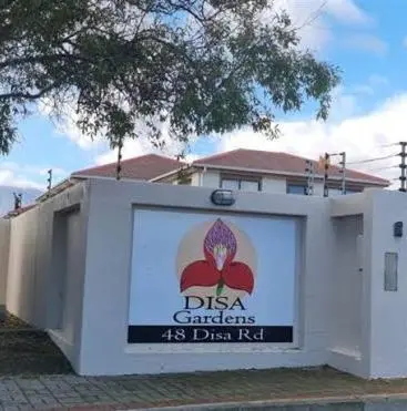 a white building with a sign in front of it at Rehoboth in Cape Town