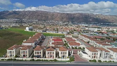 an aerial view of a city with houses and mountains at Rehoboth in Cape Town