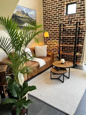 a living room with a couch and a coffee table at Enchanted View from Above in Stellenbosch