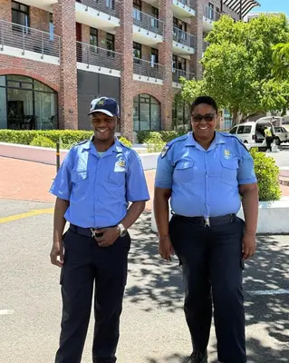two police officers standing in front of a building at Urban Oasis loft in Stellenbosch in Stellenbosch