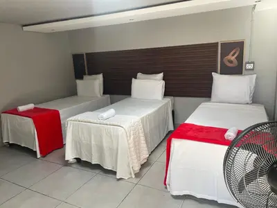 a room with two beds and a fan at Ayan Contractors & Student Accommodation in Avondale