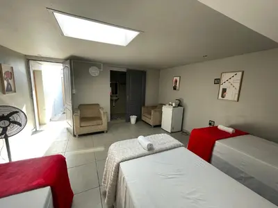 a bedroom with two beds and a skylight at Ayan Contractors & Student Accommodation in Avondale