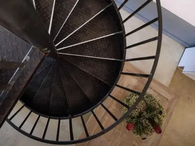 a spiral staircase with some plants on the floor at Morgenzon Farm in Wellington