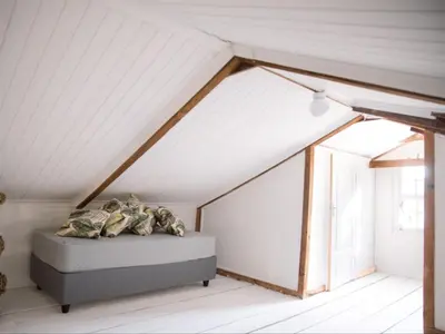 a bedroom with a bed in a attic at Morgenzon Farm in Wellington