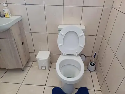 a small bathroom with a toilet and a sink at Oakway Guest Suite 2 Beds 1Bath Aircon Kitchen Private in Kuilsrivier