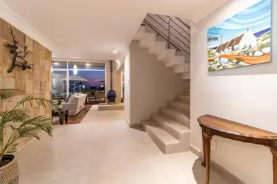 a staircase in a home with a painting on the wall at 