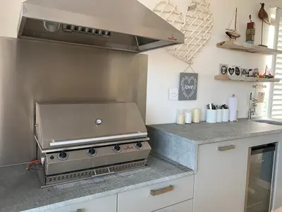 a grill in a kitchen with a counter top at Soul Place in Pringle Bay