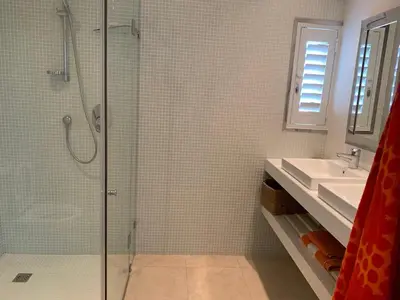 a bathroom with a shower and a sink at Soul Place in Pringle Bay