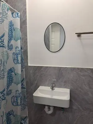 a bathroom with a sink and a mirror at 60 On Kosmos in Bellville South
