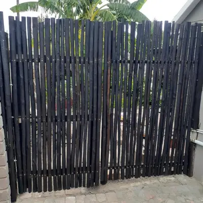 a black gate in front of a building at Rosa Villa in Hermanus