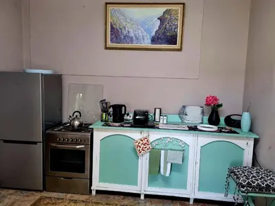 a kitchen with a stove and a counter top at UITZICHT STAY Durbanville Pet Friendly in Oakdale