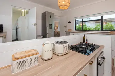 a kitchen with a counter top with a appliance on it at Fun in the Voelklip Sun in Hermanus