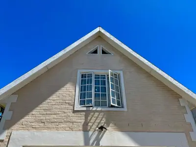 a window on the side of a house at The Loft House in Cape Town