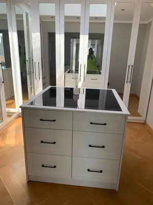 a large white dresser in a room with mirrors at Classy 3 storey house in Gordonʼs Bay