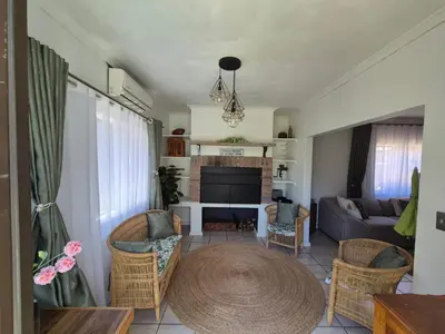 a living room with a couch and a table at ESME's REST in Cape Town