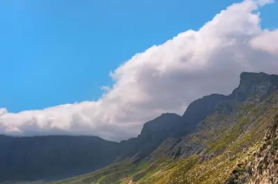 a view of a mountain with clouds in the sky at Tweede Boom in Cape Town